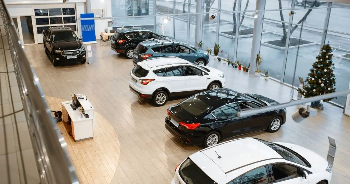 Indoor used car showroom with several late-model vehicles on display